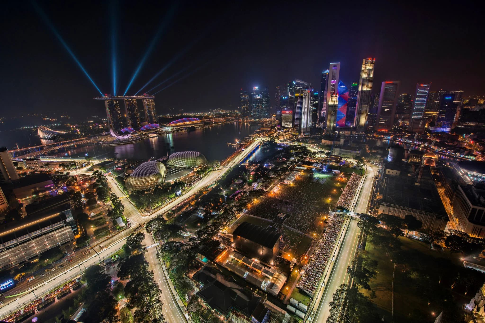 The illuminated Singapore Grand Prix circuit and city skyline at night