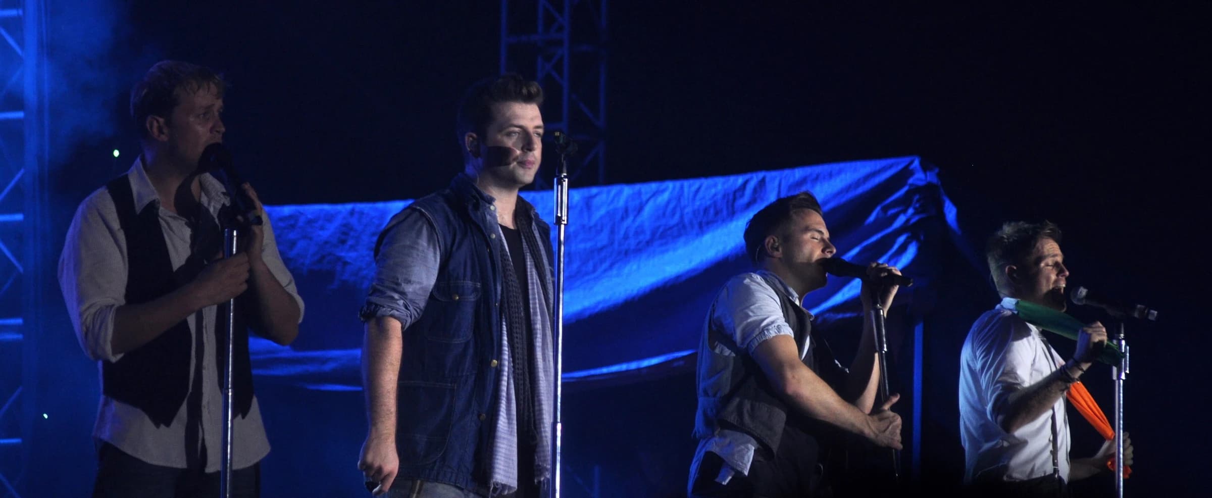 Westlife performing together on stage